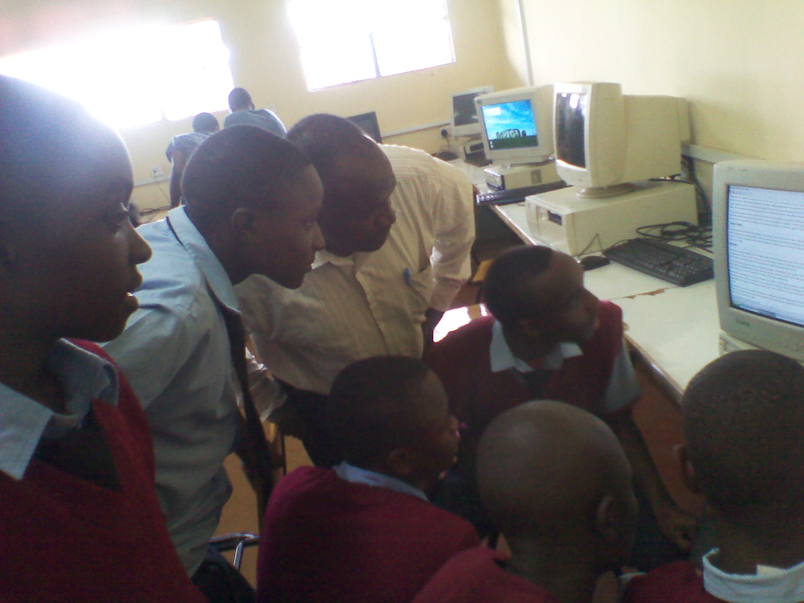 Students engaging with learning resources at a Kenyan secondary school
